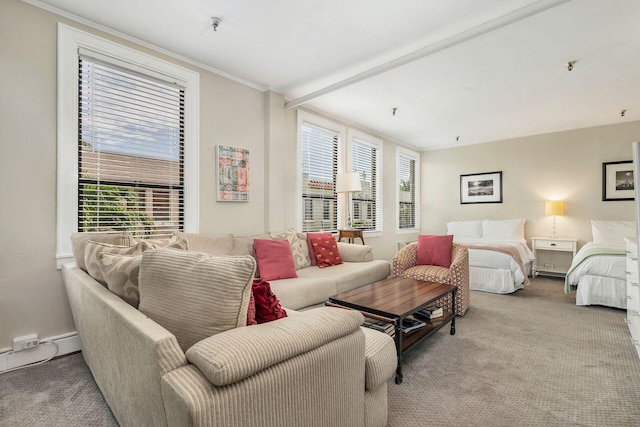 living room featuring light colored carpet and beamed ceiling