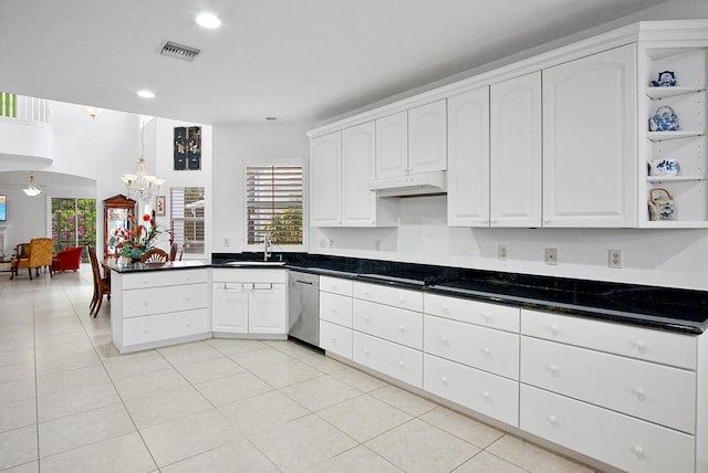 kitchen featuring white cabinetry, sink, light tile floors, and stainless steel dishwasher