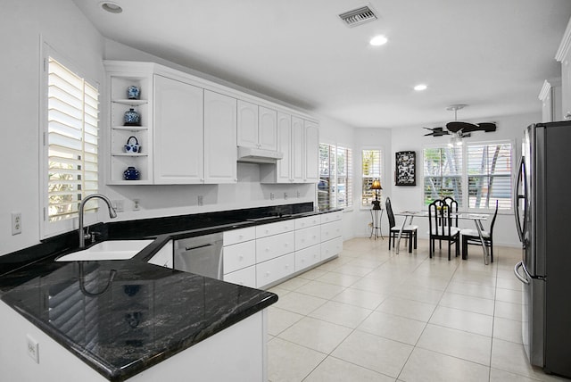 kitchen featuring ceiling fan, white cabinets, sink, light tile floors, and appliances with stainless steel finishes