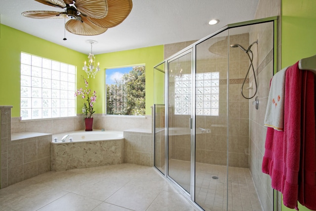 bathroom with tile flooring and separate shower and tub