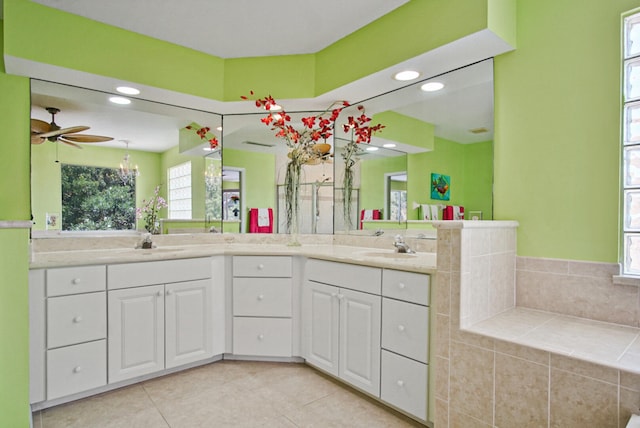 bathroom with tile floors, plenty of natural light, ceiling fan, and double vanity