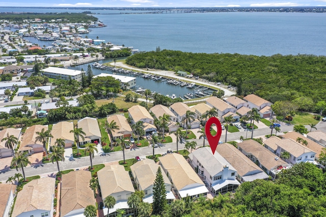 birds eye view of property featuring a water view