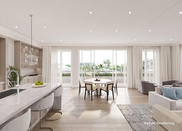 dining area with light wood-type flooring, sink, and a notable chandelier