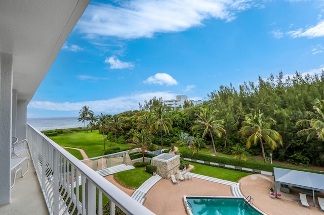 exterior space featuring a water view, a yard, and a patio area