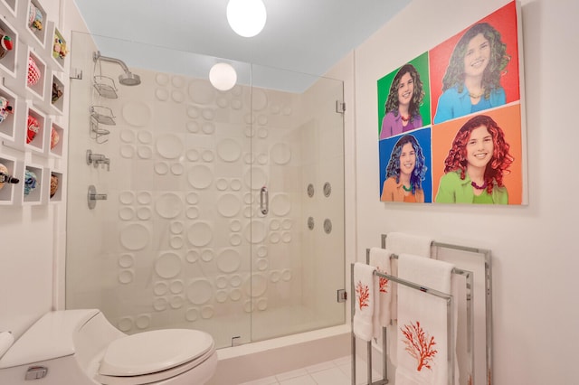 bathroom with an enclosed shower, tile floors, and toilet