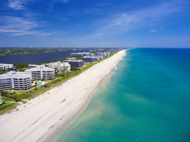 bird's eye view featuring a beach view and a water view