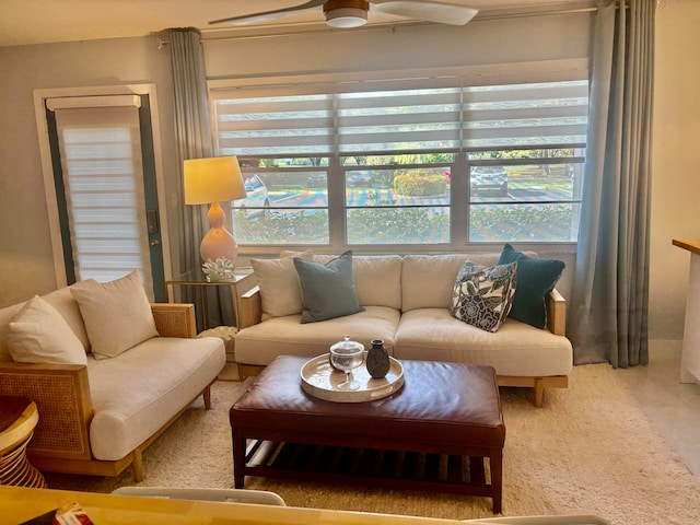 living room with carpet flooring and ceiling fan