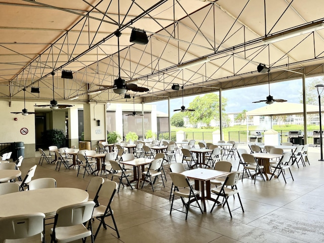 dining space with expansive windows and concrete flooring