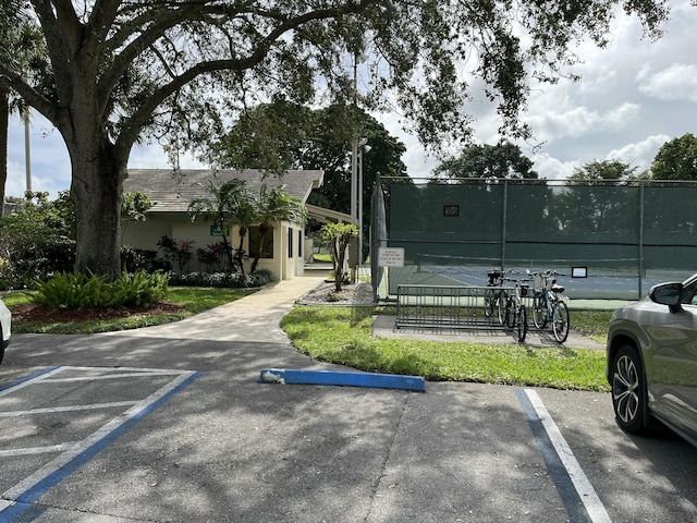 exterior space featuring tennis court