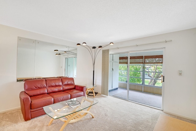 carpeted living room with a textured ceiling