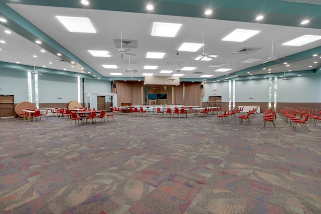 misc room featuring ceiling fan and dark colored carpet