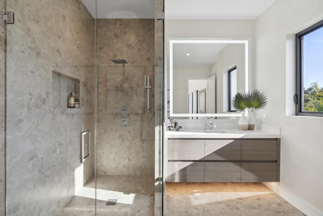 bathroom with vanity and a shower stall