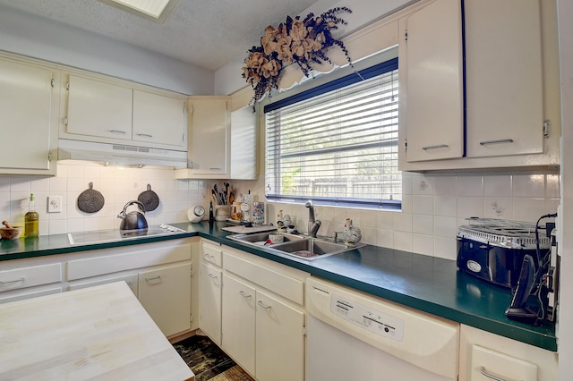 kitchen with white dishwasher, black electric cooktop, backsplash, and sink