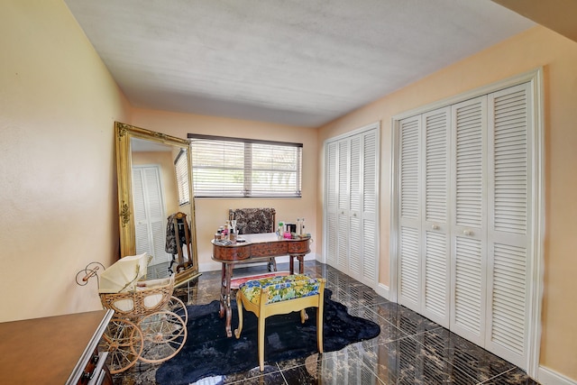 office area featuring dark tile flooring