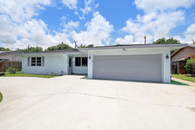 single story home with a garage