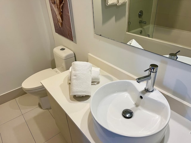 full bathroom featuring vanity, shower / tub combination, tile floors, and toilet