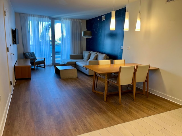 dining area with dark hardwood / wood-style flooring