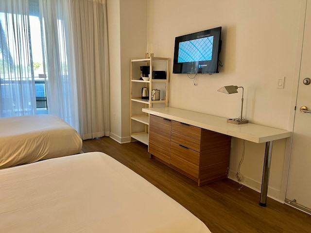 bedroom featuring dark wood-type flooring