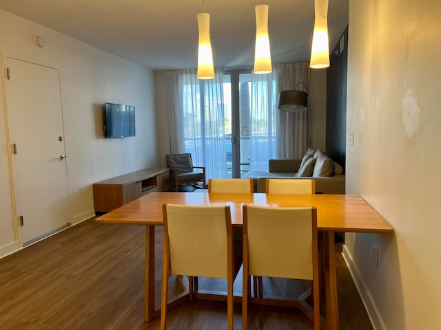 dining room featuring dark hardwood / wood-style flooring