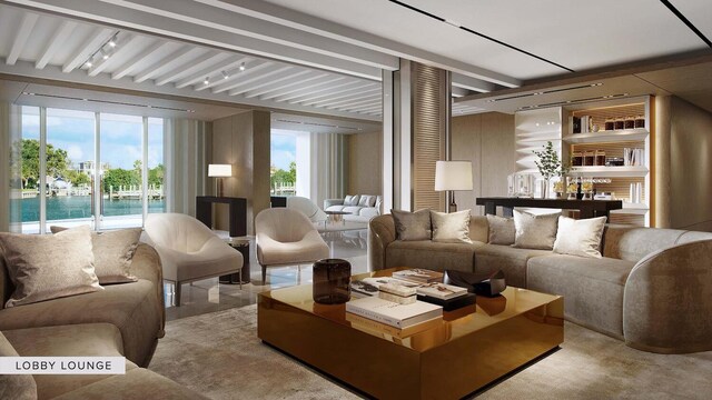 living room with beamed ceiling and a water view