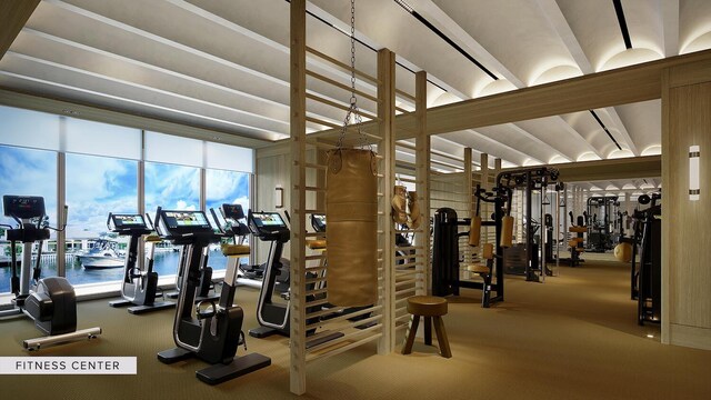 workout room featuring coffered ceiling, carpet flooring, and wood walls