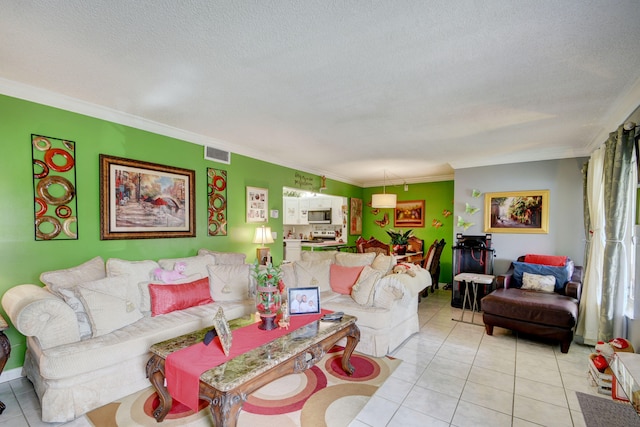 living room featuring light tile flooring, ornamental molding, and a textured ceiling