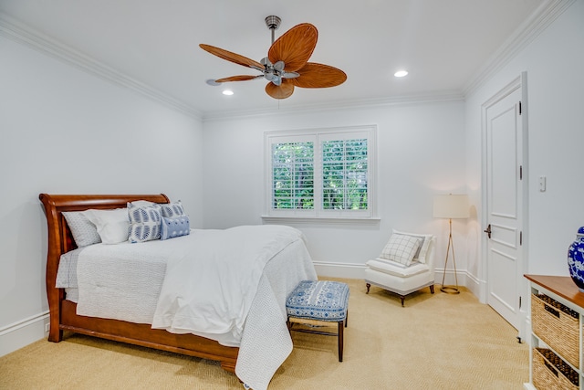 bedroom featuring light carpet, ceiling fan, and crown molding