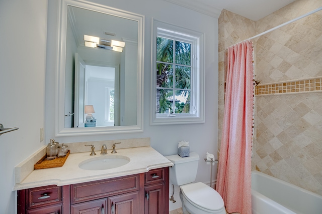 full bathroom featuring ornamental molding, vanity, toilet, and shower / bathtub combination with curtain