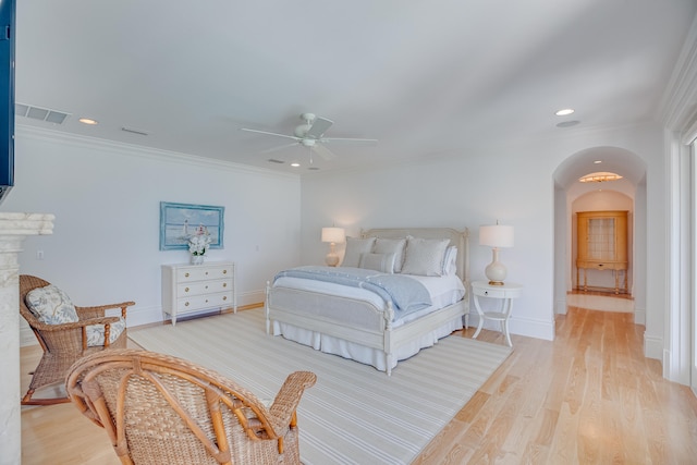 bedroom with ceiling fan, light hardwood / wood-style flooring, and crown molding