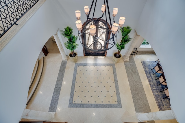 room details featuring a chandelier and light tile floors