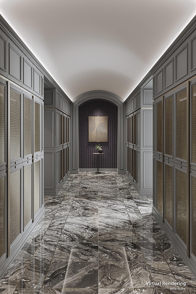 hallway with dark tile flooring