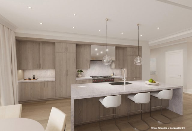 kitchen with hanging light fixtures, tasteful backsplash, a center island with sink, and light stone counters