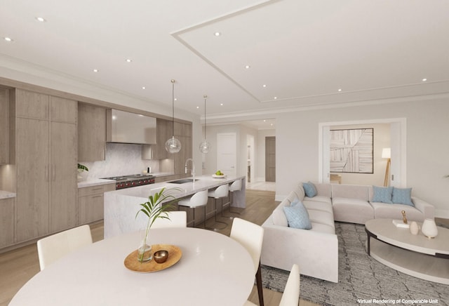 dining space featuring sink and light hardwood / wood-style flooring