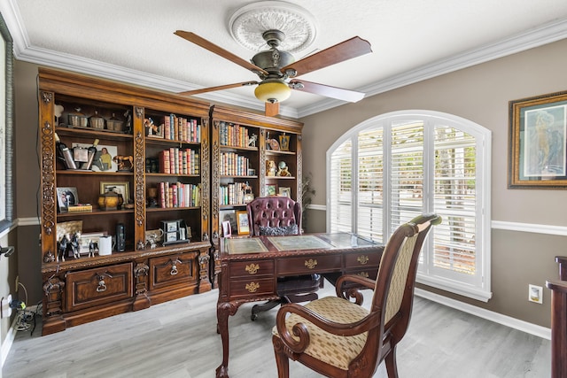 office with a textured ceiling, light wood-type flooring, ceiling fan, and crown molding