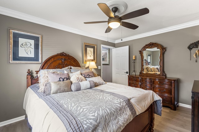 2559 Palm Deer Dr, Loxahatchee, FL 33470 - bedroom with baseboards, crown molding, light wood-type flooring, and ceiling fan