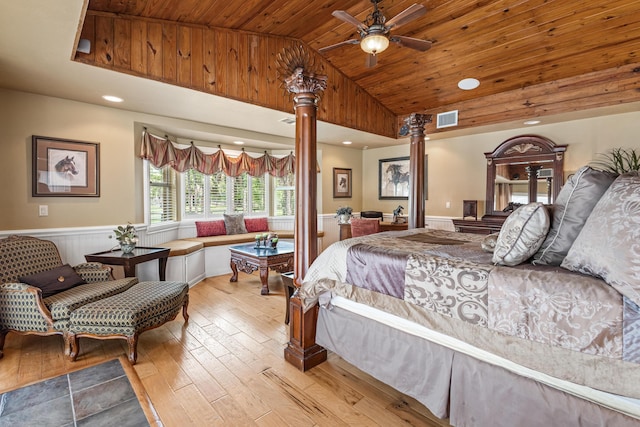 bedroom with wooden ceiling, high vaulted ceiling, light hardwood / wood-style flooring, ceiling fan, and ornate columns