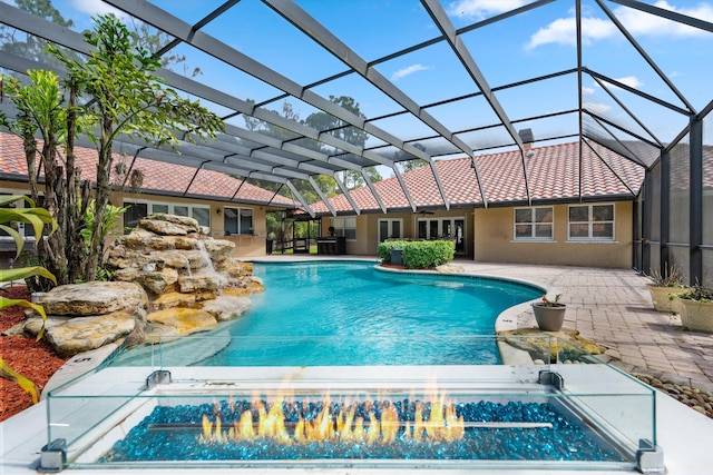 2559 Palm Deer Dr, Loxahatchee, FL 33470 - outdoor pool featuring a patio and glass enclosure