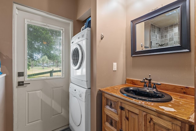 2559 Palm Deer Dr, Loxahatchee, FL 33470 - laundry room with stacked washer and clothes dryer and a sink