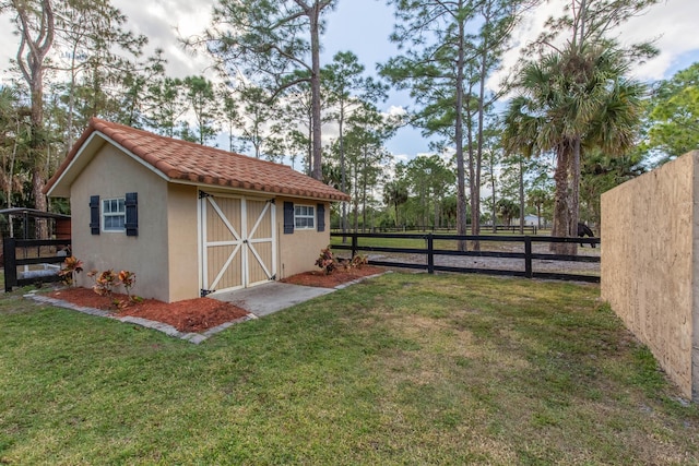 view of outbuilding with a yard