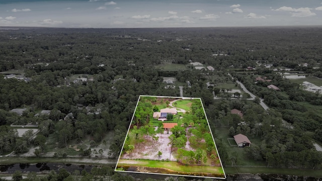 2559 Palm Deer Dr, Loxahatchee, FL 33470 - aerial overview of property's location featuring a forest and property boundaries highlighted