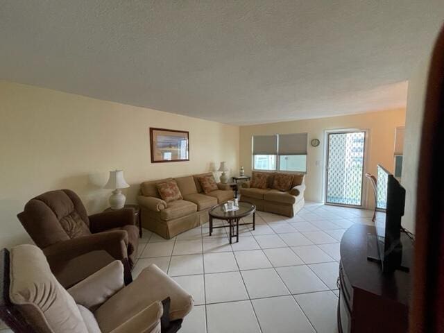 living room featuring light tile flooring