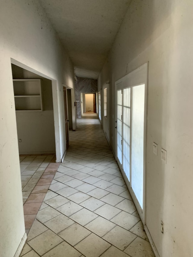 hallway featuring light tile patterned floors