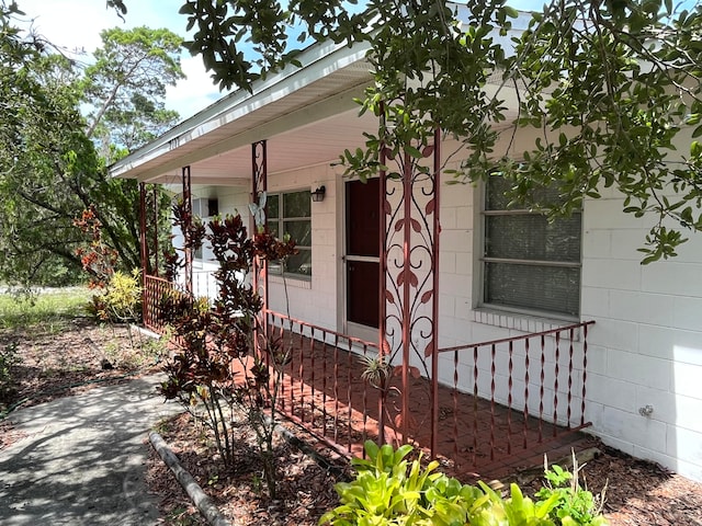 view of side of home with a porch