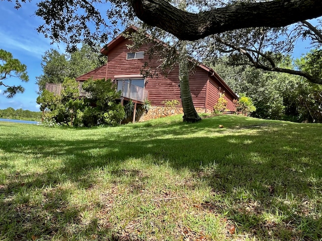 view of side of property with a yard