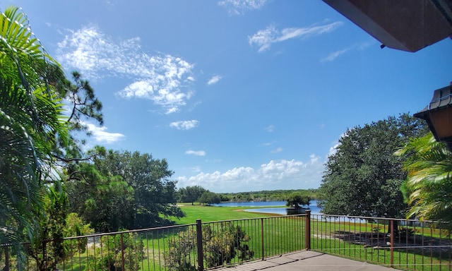 exterior space featuring a water view and a lawn