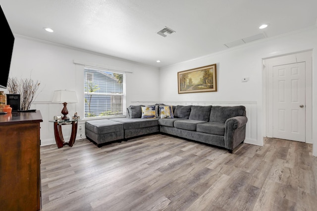 422 49th St, West Palm Beach, FL 33407 - living area featuring crown molding, light wood finished floors, and recessed lighting