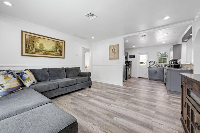 422 49th St, West Palm Beach, FL 33407 - living area with crown molding, light wood-style flooring, and recessed lighting