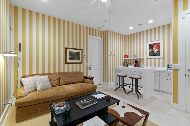 living room with ceiling fan and light tile flooring