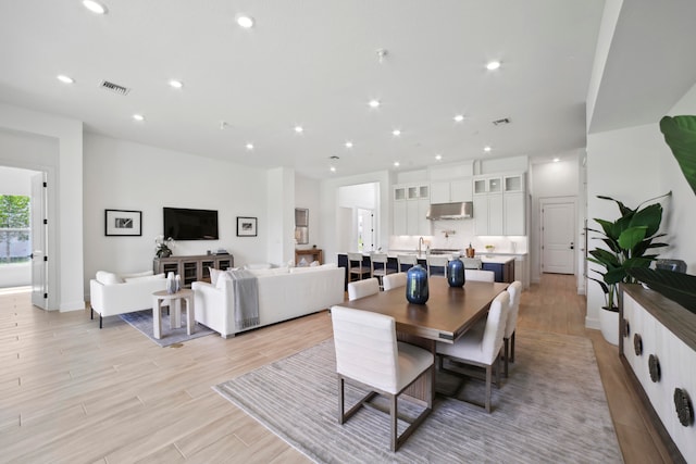 dining area with light wood-type flooring