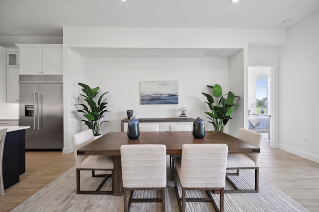 dining space with light wood-type flooring